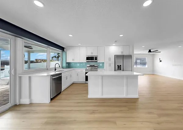 a view of kitchen with wooden floor