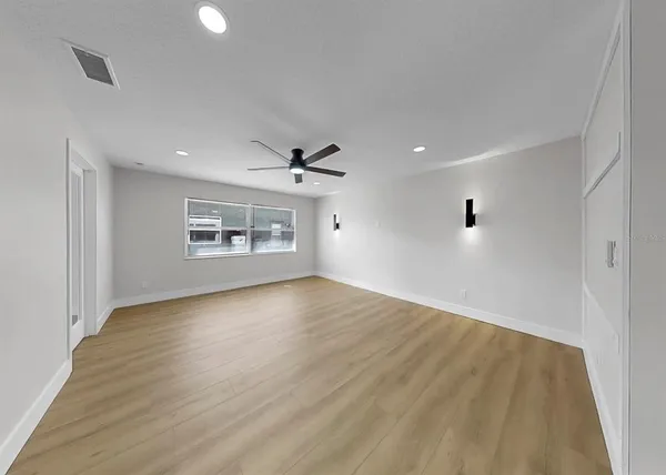 a living room with furniture window and a flat screen tv