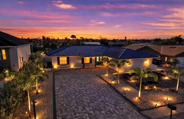 a view of a swimming pool with an outdoor seating