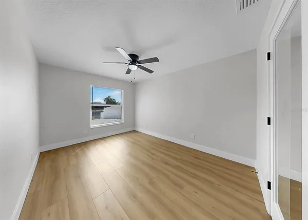 a living room with furniture a rug and a window