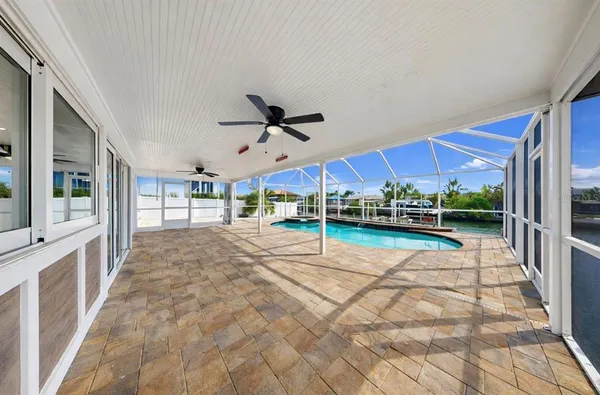 a view of a swimming pool with a patio