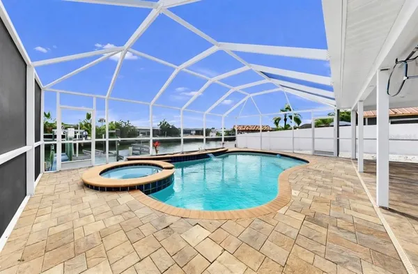 a view of a swimming pool with a patio