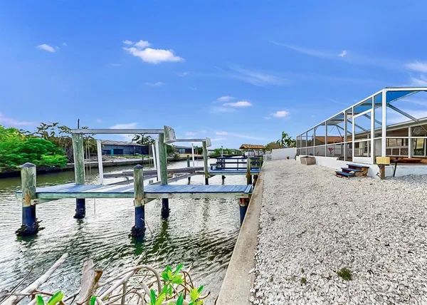 a view of a swimming pool with a patio