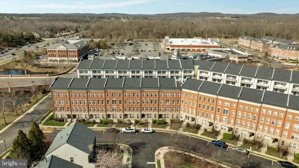 an aerial view of residential building with parking