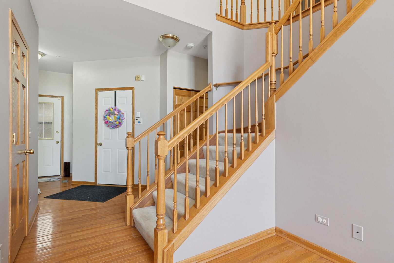 2014 Ivy Ridge Drive Hoffman Estates, IL 60192 - Photo 4 of 14 a view of entryway and hall with wooden floor