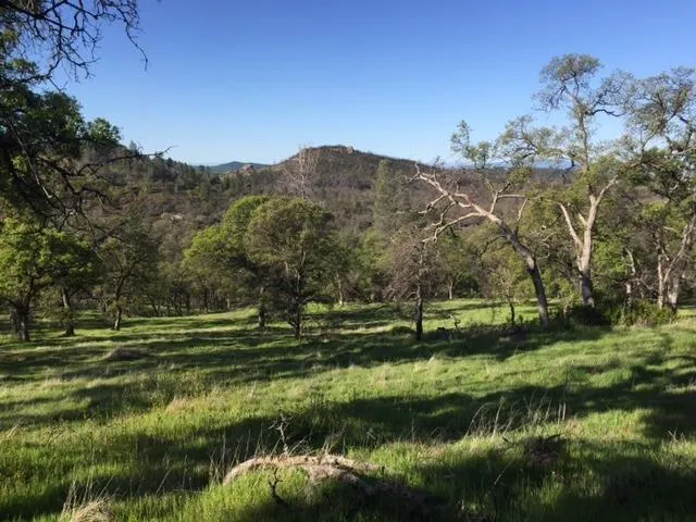 a view of a town with mountains in the background