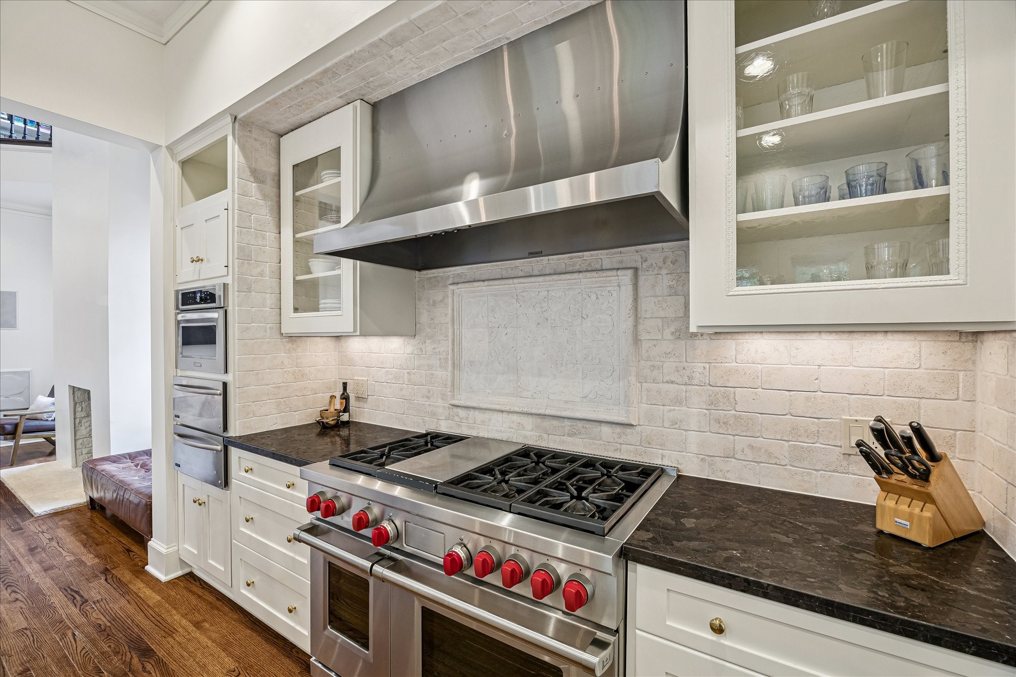 2368 Timber Lane Houston, TX 77027 - Photo 14 of 46 The chef’s kitchen is outfitted with a professional-grade suite of stainless steel appliances designed for both everyday living and serious culinary entertaining. Highlights include a 48" Wolf six-burner range with griddle, a Sub-Zero Pro 48" refrigerator/freezer, KitchenAid microwave and Bosch dishwasher, dual Thermador warming drawers, and a Blanco undermount sink paired with polished nickel Hansgrohe Axor fixtures for a refined finishing touch.