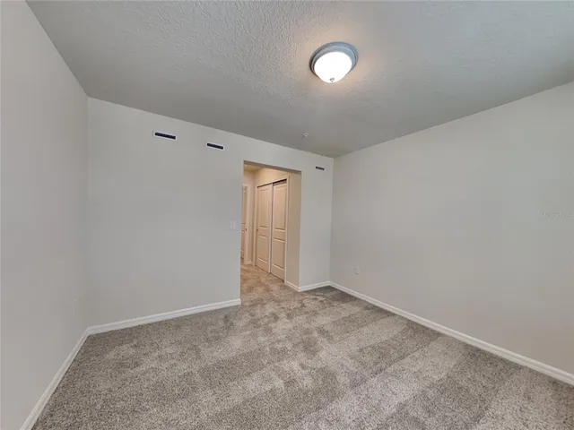 a white bath tub sitting next to a white toilet and sink