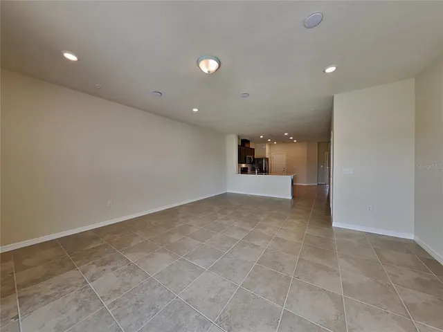 a view of a livingroom with a kitchen