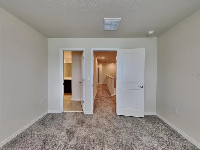 an empty room with mirror