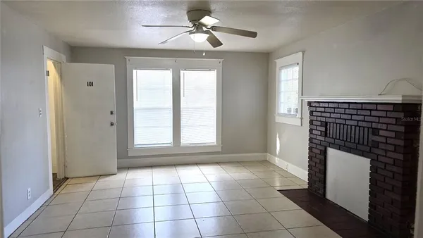 a view of an empty room with a window