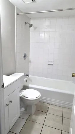 a bathroom with a sink a toilet and a bathtub