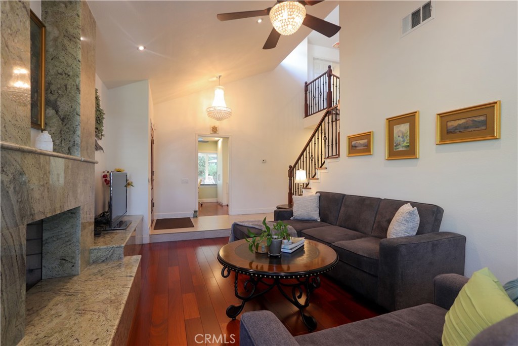8 Sandpiper Irvine, CA 92604 - Photo 11 of 45 a living room with furniture and a fireplace