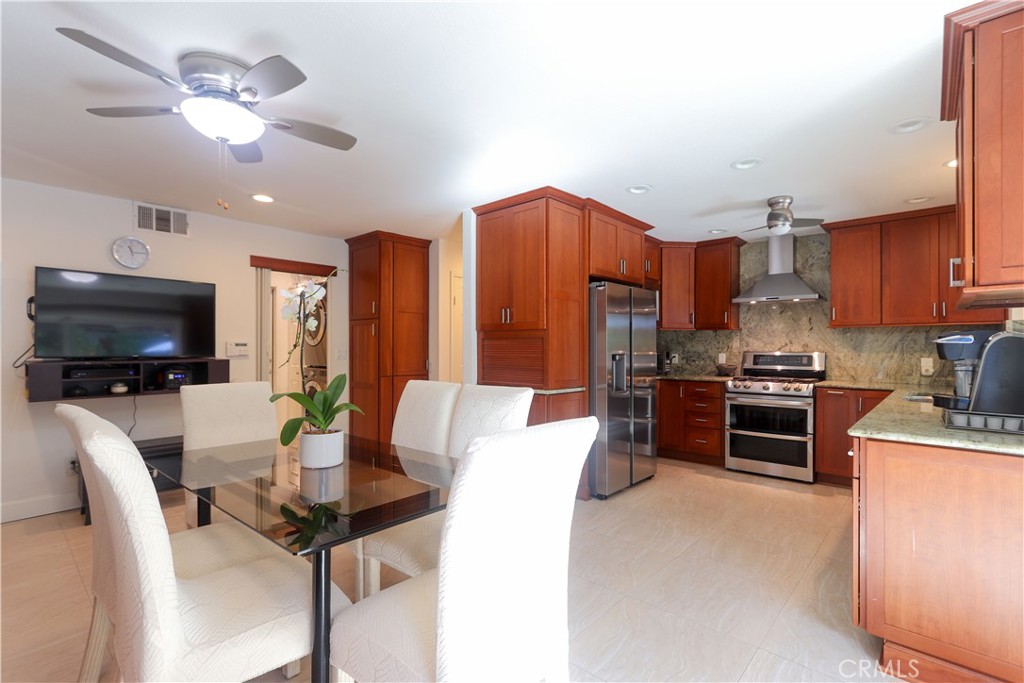 8 Sandpiper Irvine, CA 92604 - Photo 17 of 45 a kitchen with stainless steel appliances granite countertop a stove refrigerator and a sink