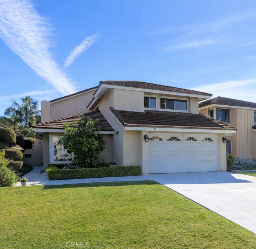 8 Sandpiper Irvine, CA 92604 - Photo 2 of 45 a front view of a house with a yard garage and outdoor seating
