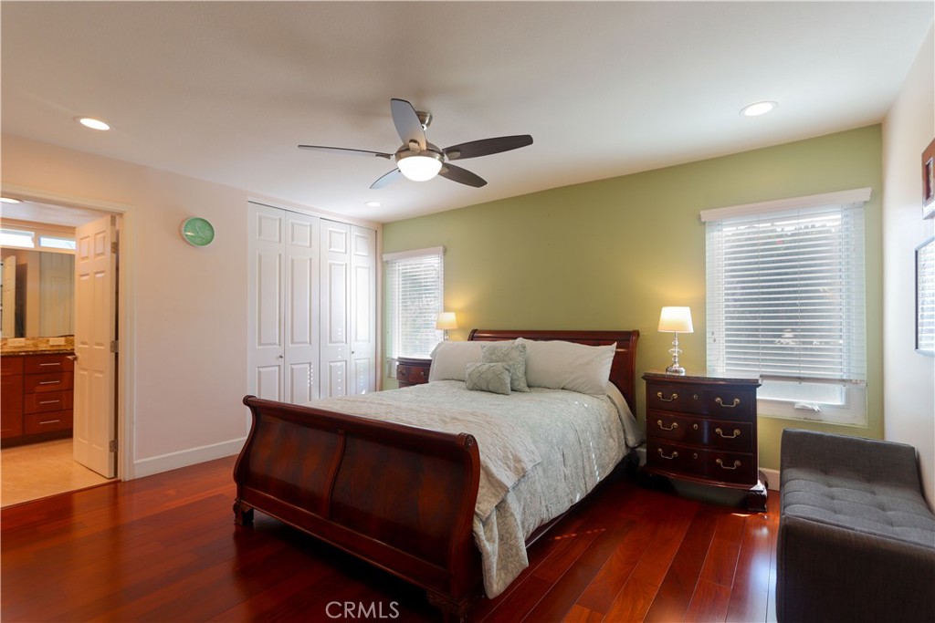 8 Sandpiper Irvine, CA 92604 - Photo 25 of 45 a bedroom with a bed and wooden floor