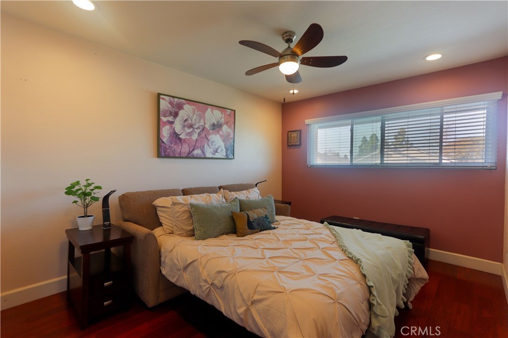 8 Sandpiper Irvine, CA 92604 - Photo 29 of 45 a bedroom with a bed and a chandelier