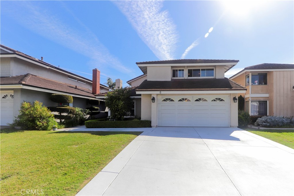 8 Sandpiper Irvine, CA 92604 - Photo 3 of 45 a front view of a house with a yard and garage