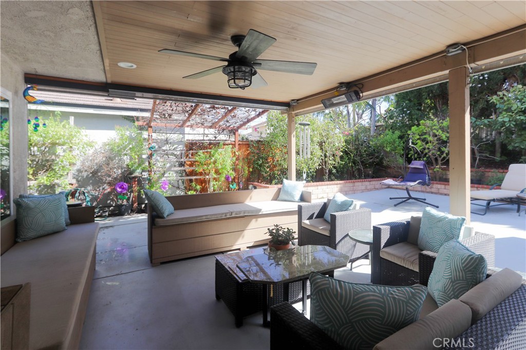 8 Sandpiper Irvine, CA 92604 - Photo 35 of 45 a living room with patio furniture and a large window