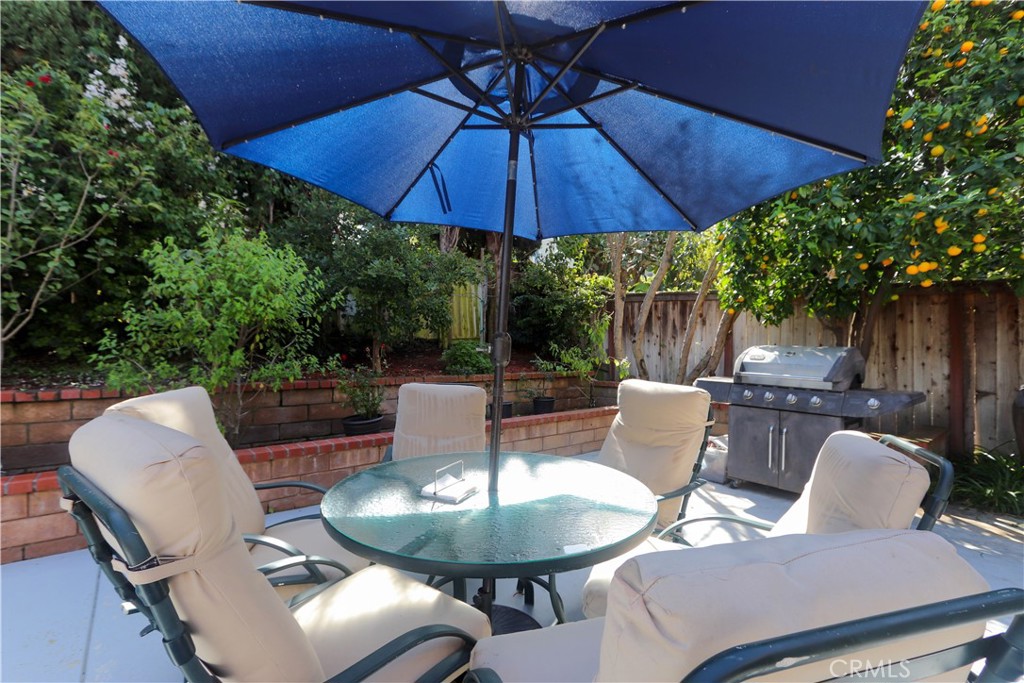 8 Sandpiper Irvine, CA 92604 - Photo 39 of 45 a patio with a patio table and chairs