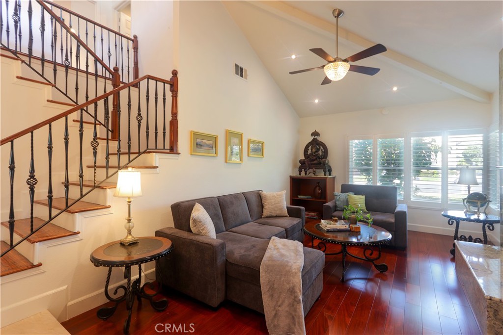 8 Sandpiper Irvine, CA 92604 - Photo 9 of 45 a living room with furniture fireplace and wooden floor