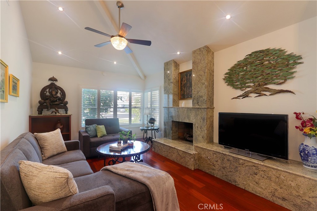 8 Sandpiper Irvine, CA 92604 - Photo 10 of 45 a living room with furniture and a fireplace