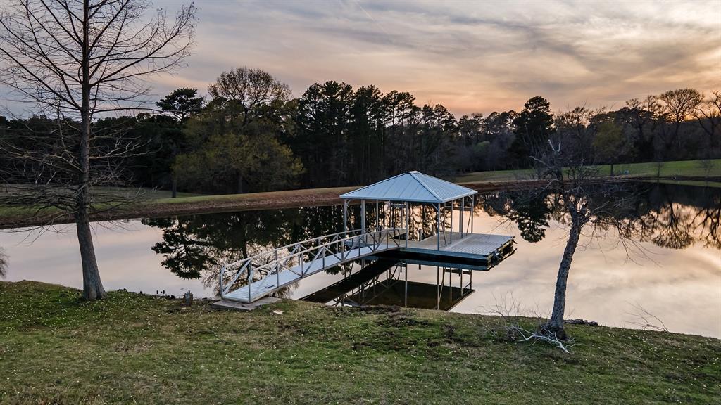 a view of a chairs and table in the river