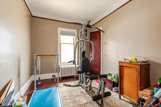 a bedroom with furniture and a flat screen tv
