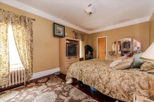 a bedroom with bed and a window