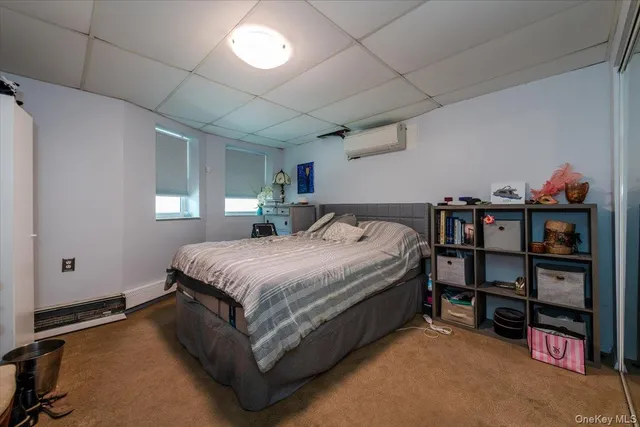 a bedroom with a bed and a book shelf