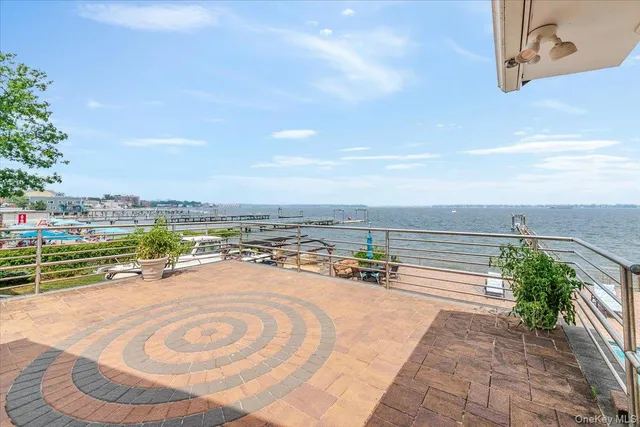 an outdoor space with patio ocean and ocean view
