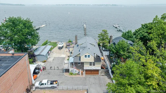 an aerial view of a house with outdoor space