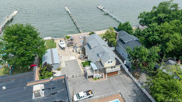 an aerial view of multiple houses with outdoor space