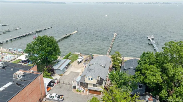 an aerial view of houses with yard