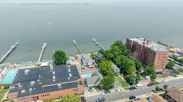 an aerial view of a house with a lake view