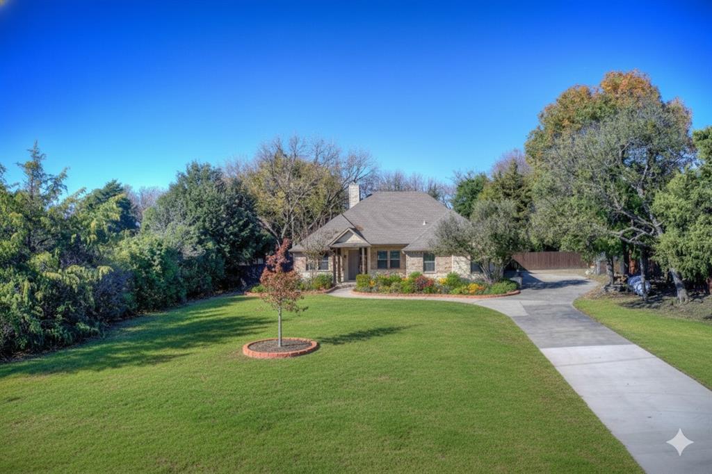 2617 Kirby Road Rowlett, TX 75088 - Photo 2 of 39 View of front of home with a chimney and driveway