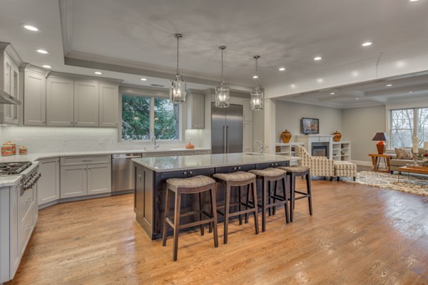 39 Lorena Road Winchester, MA 01890 - Photo 11 of 30 a large kitchen with lots of furniture a sink appliances and a dining table