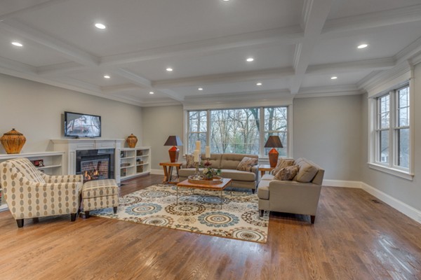 39 Lorena Road Winchester, MA 01890 - Photo 15 of 30 a living room with fireplace furniture and a wooden floor