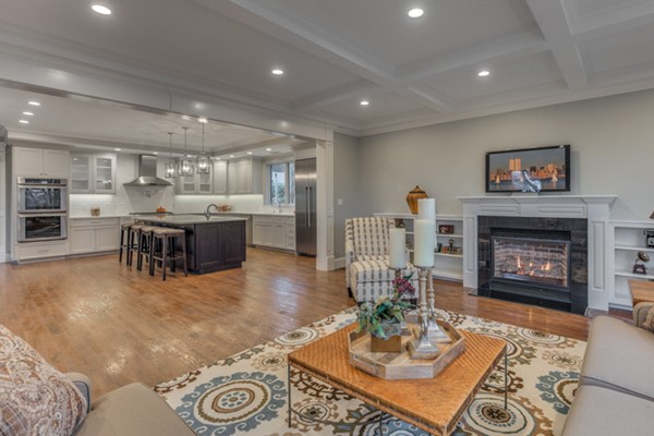 39 Lorena Road Winchester, MA 01890 - Photo 18 of 30 a living room with furniture a table and a fireplace