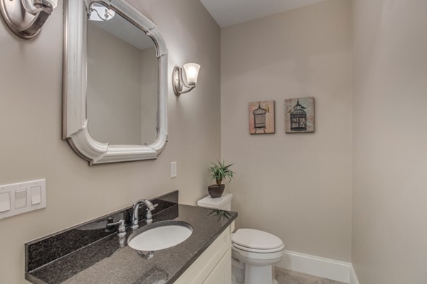 39 Lorena Road Winchester, MA 01890 - Photo 19 of 30 a bathroom with a granite countertop sink and a mirror