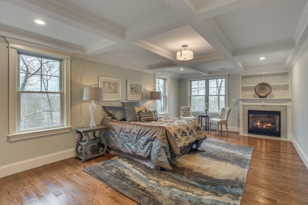 39 Lorena Road Winchester, MA 01890 - Photo 21 of 30 a living room with a bed furniture and a fireplace