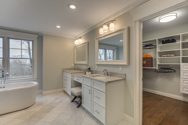 39 Lorena Road Winchester, MA 01890 - Photo 23 of 30 a bathroom with a granite countertop sink mirror and bathtub