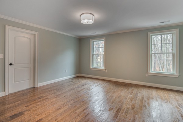 39 Lorena Road Winchester, MA 01890 - Photo 24 of 30 a view of an empty room with wooden floor and a window