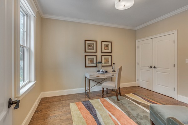 39 Lorena Road Winchester, MA 01890 - Photo 7 of 30 a living room with a table chairs and a window