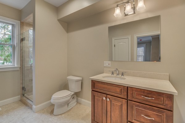 39 Lorena Road Winchester, MA 01890 - Photo 8 of 30 a bathroom with a toilet sink and mirror