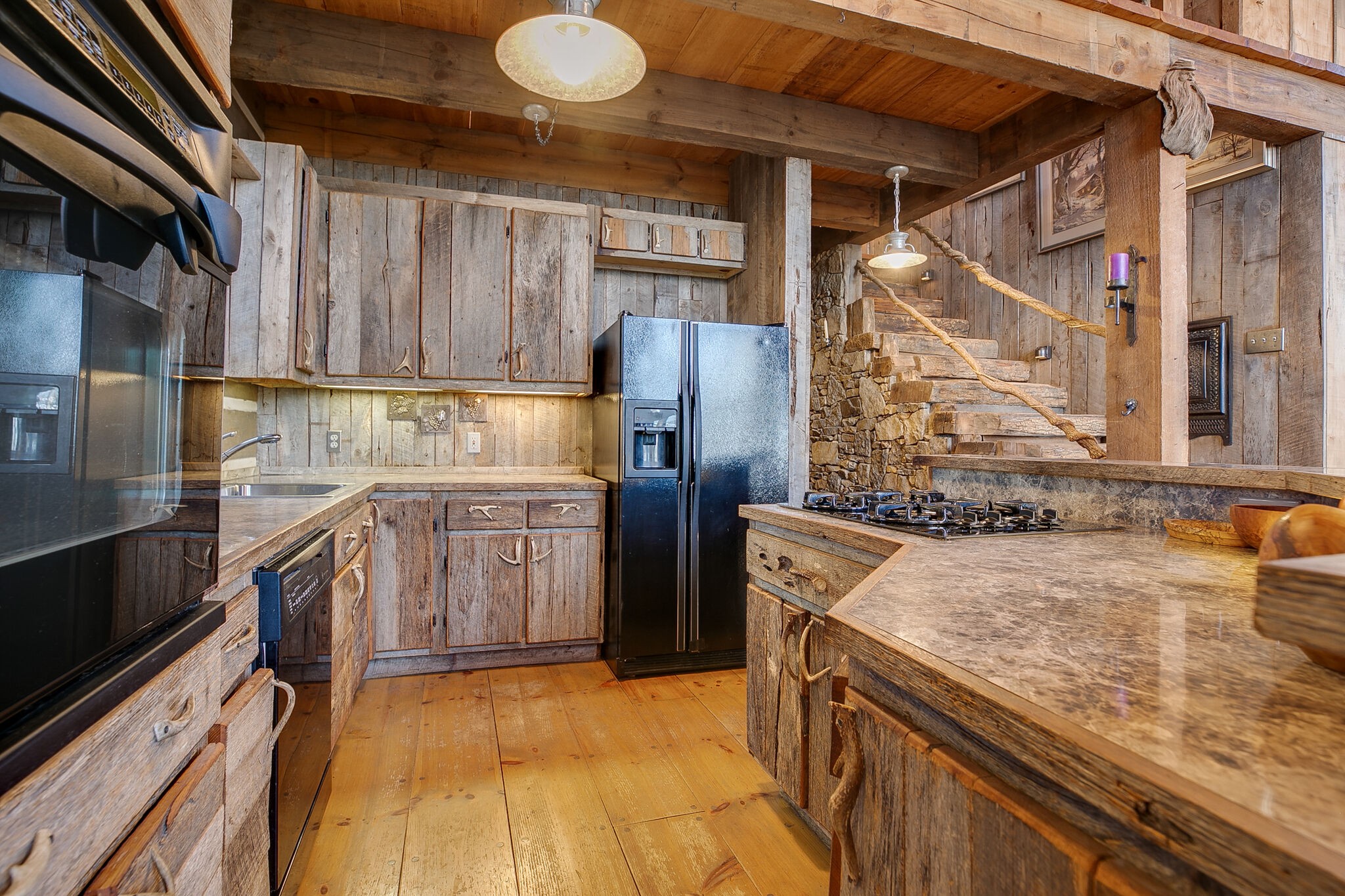 660 Rocky Top Road Sparta, TN 38583 - Photo 19 of 39 a kitchen with a sink cabinets and stainless steel appliances