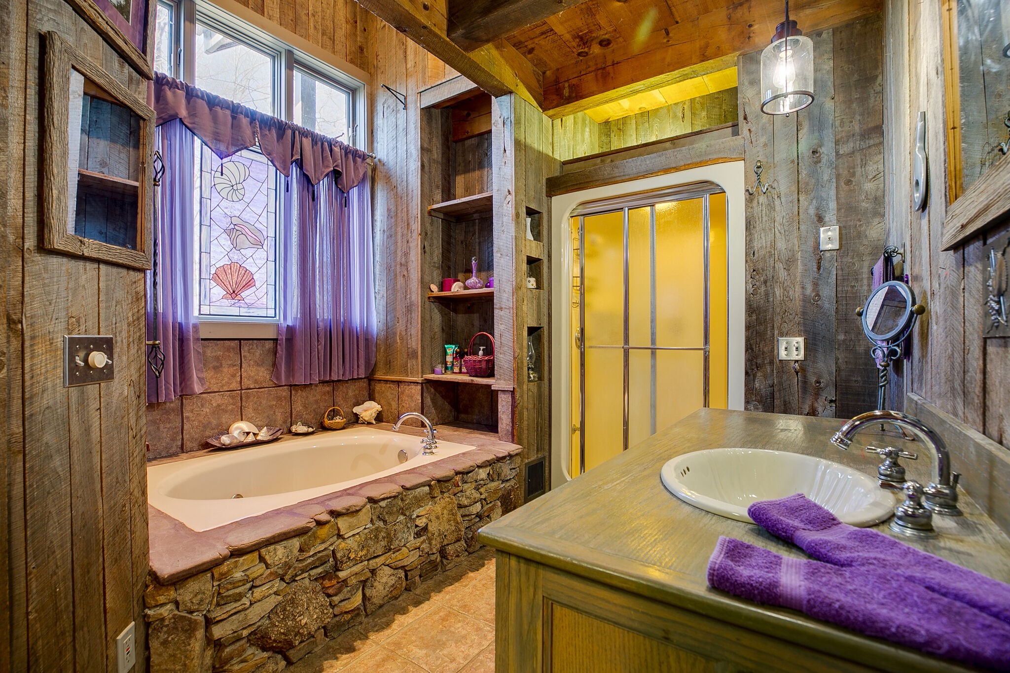660 Rocky Top Road Sparta, TN 38583 - Photo 26 of 39 a bathroom with a sink and a mirror