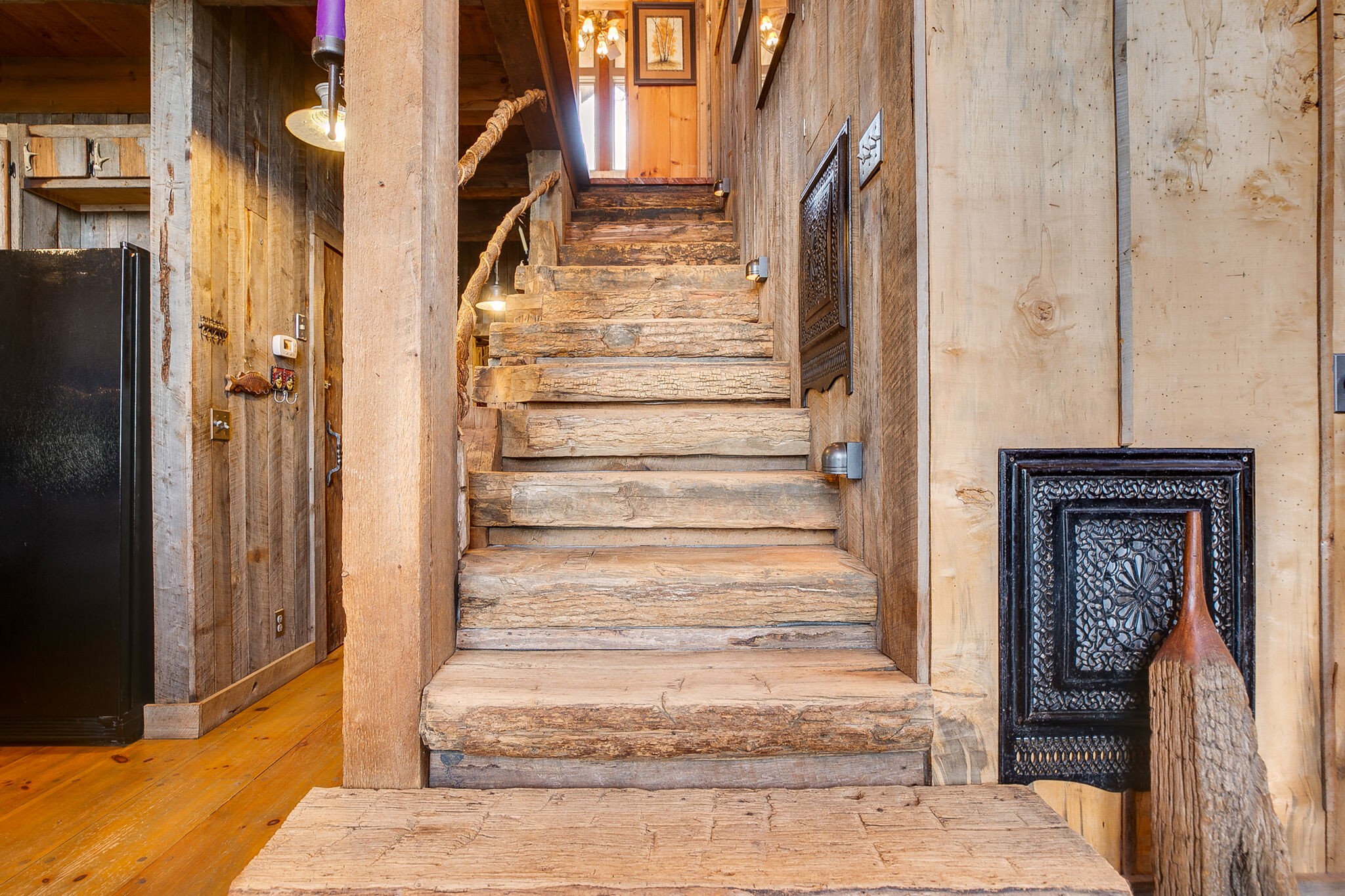 660 Rocky Top Road Sparta, TN 38583 - Photo 28 of 39 a view of staircase with white walls and a fireplace