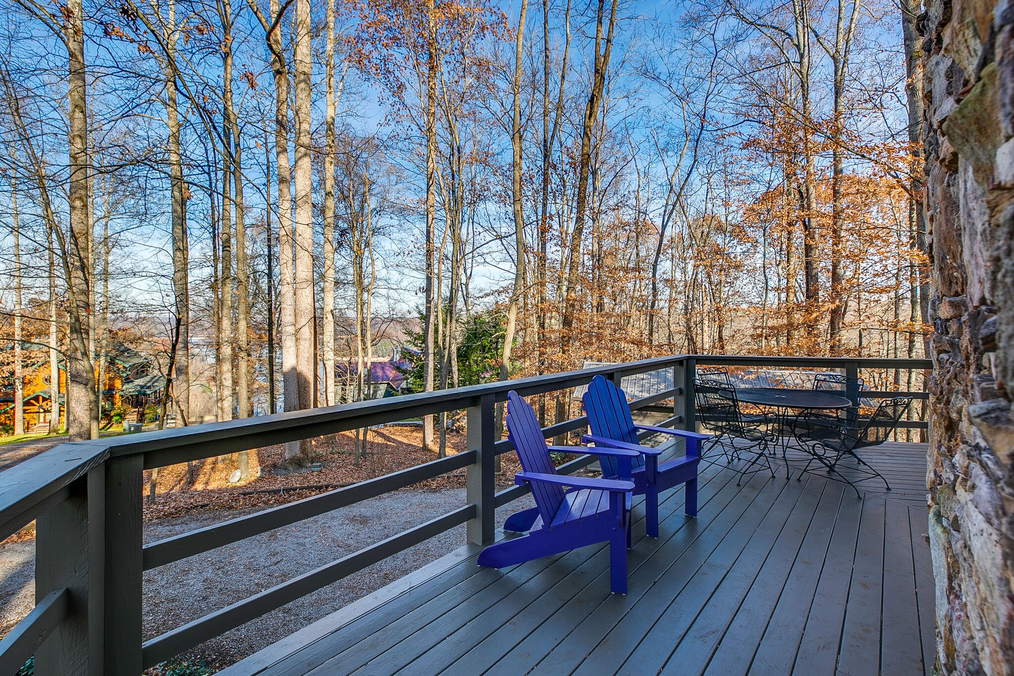660 Rocky Top Road Sparta, TN 38583 - Photo 9 of 39 a balcony with wooden benches and sitting area