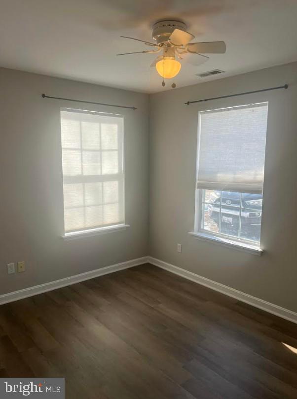 105 Gravel Run Road Grasonville, MD 21638 - Photo 8 of 12 a view of an empty room with wooden floor and a window